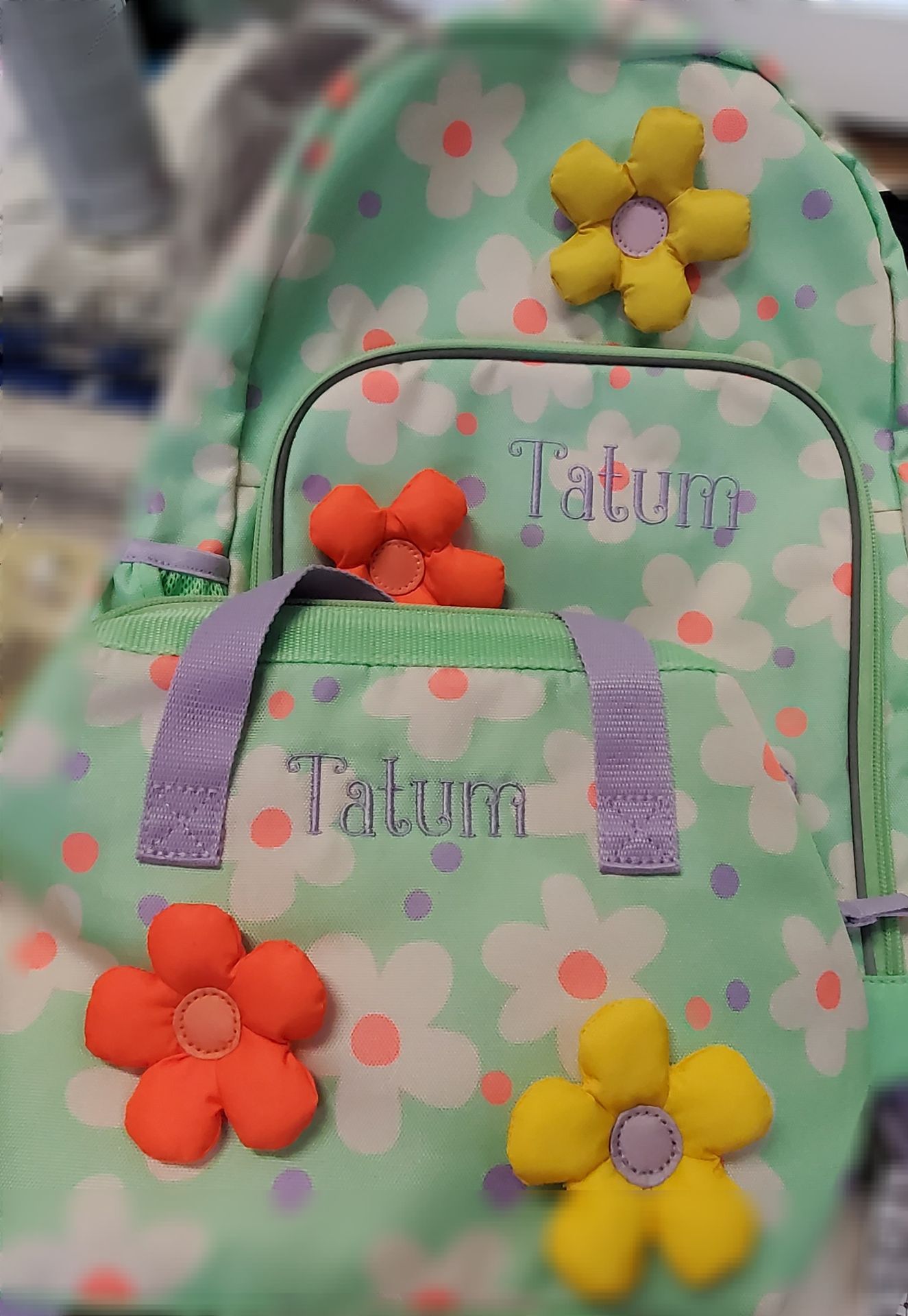 Personalized floral backpack embroidered with the name Tatum